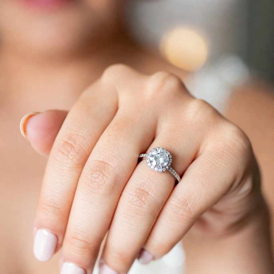 hand showing off a diamond ring